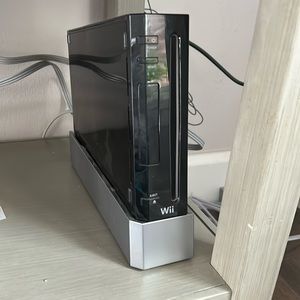 Nintendo Wii console with some games and accessories
